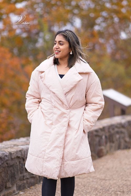 Woman in a pale coat during an autumn portrait session