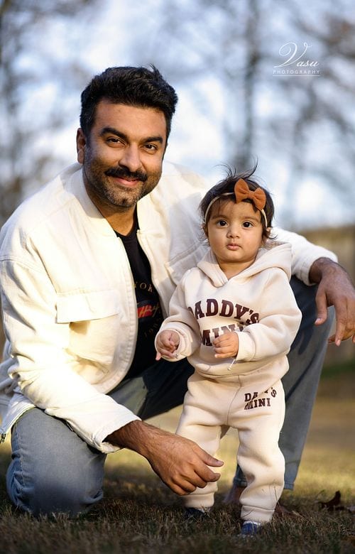 Father and young child together during an outdoor portrait