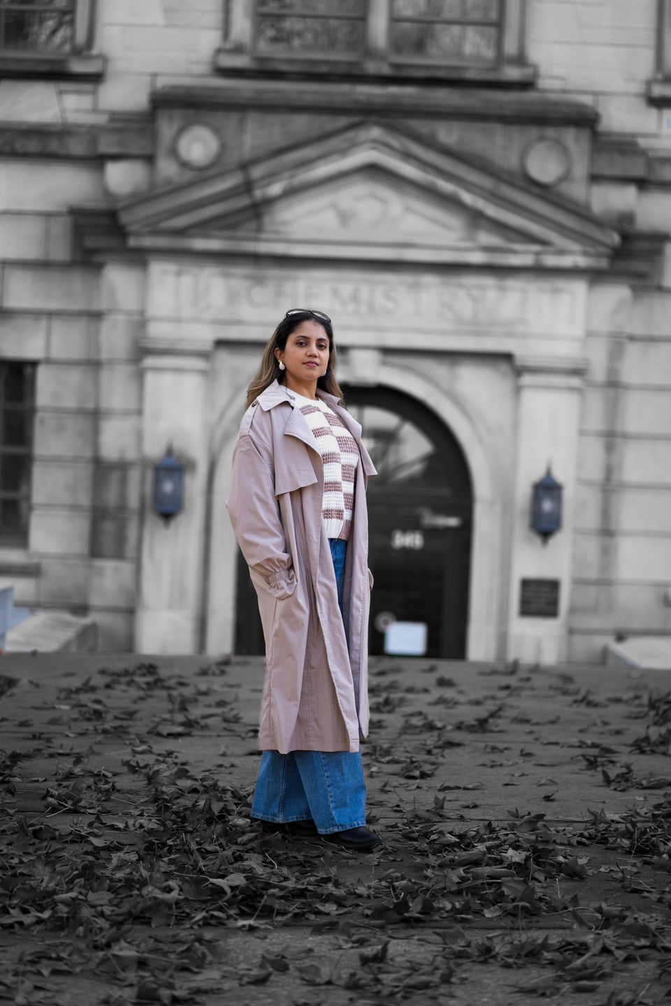 Woman photographed on the steps of a university building